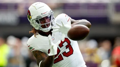 Arizona Cardinals running back Corey Clement (23) handles the ball against Minnesota  Vikings cornerback Jaylin Williams (38) during the second half of an NFL  preseason football game Saturday, Aug. 26, 2023 in