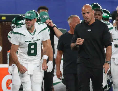 New York Jets running back Travis Dye (35) leaps over bodies