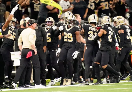 New Orleans, Louisiana, USA. 27th Dec, 2021. (left to right) New Orleans  Saints linebacker Zack Baun tries to keep a hold of Miami Dolphins running  back Duke Johnson in New Orleans, Louisiana