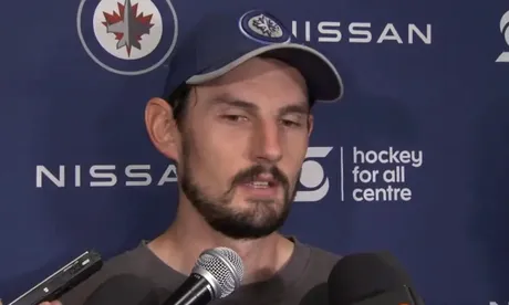 Despite cloudy futures, Hellebuyck and Scheifele focused on