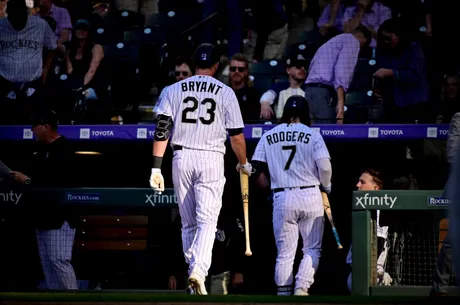 Giants open 9-run lead, hang to to beat Rockies 11-10 and stop slide