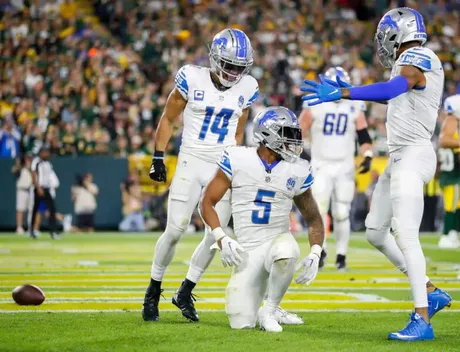 Detroit Lions' Kalif Raymond (11) celebrates with Derrick Barnes