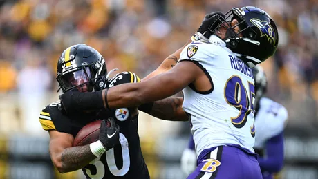 Jacksonville Jaguars defensive tackle Raequan Williams tackles Las Vegas  Raiders running back Kenyan Drake during the first half of the NFL football  exhibition Hall of Fame Game, Thursday, Aug. 4, 2022, in